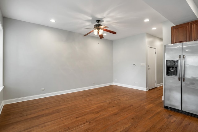 interior space featuring baseboards, stainless steel fridge with ice dispenser, ceiling fan, dark wood-style flooring, and recessed lighting