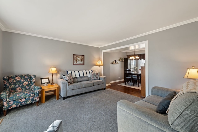 living room featuring a chandelier, ornamental molding, and baseboards