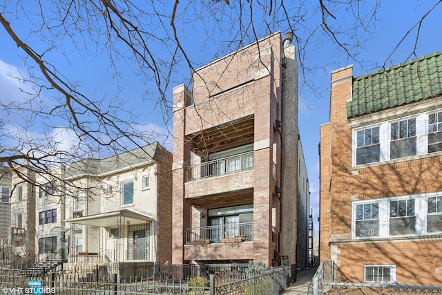 view of building exterior featuring a fenced front yard