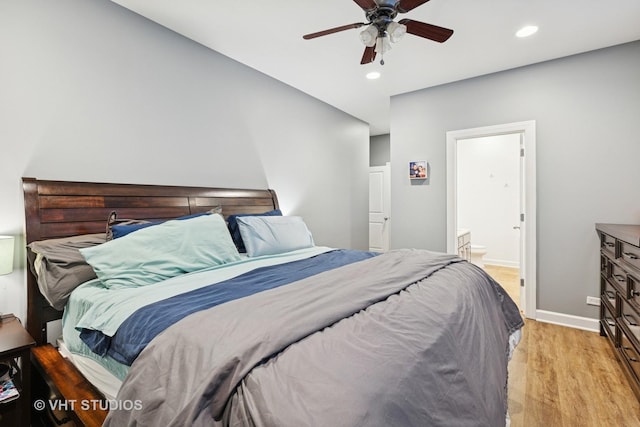 bedroom featuring baseboards, ceiling fan, recessed lighting, light wood-style flooring, and ensuite bathroom