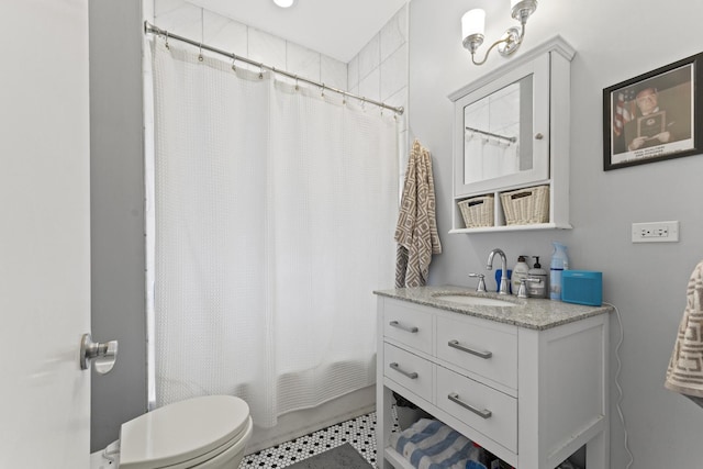 bathroom featuring vanity, toilet, and shower / bathtub combination with curtain