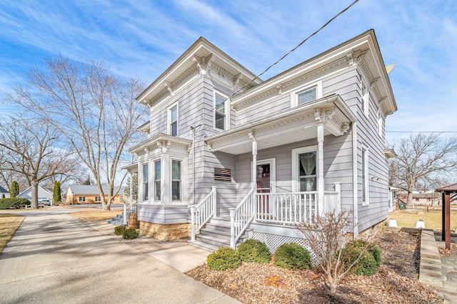 italianate-style house with a porch