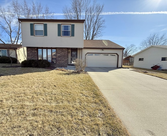 view of front facade featuring a front lawn, brick siding, driveway, and an attached garage