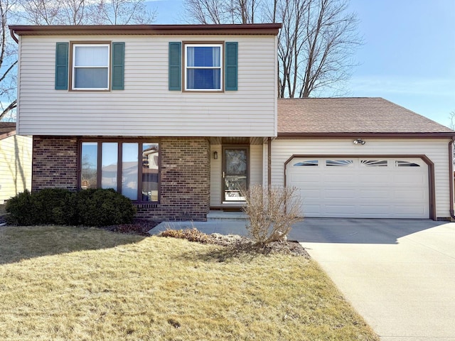 view of front of home featuring a garage, driveway, brick siding, and a front yard