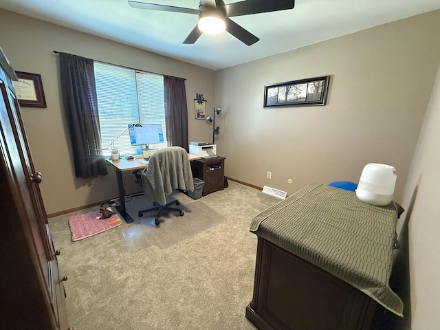 bedroom featuring light carpet, visible vents, baseboards, and ceiling fan