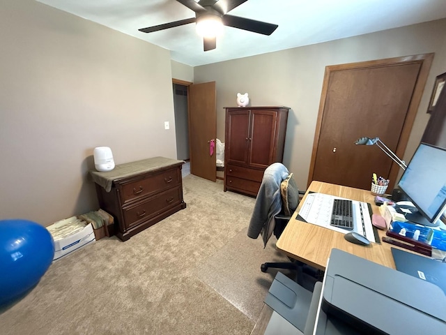 office with light carpet and ceiling fan