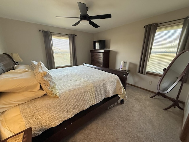 bedroom with carpet, baseboards, and ceiling fan