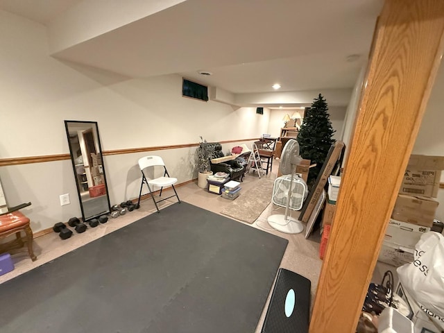 exercise room with recessed lighting and baseboards