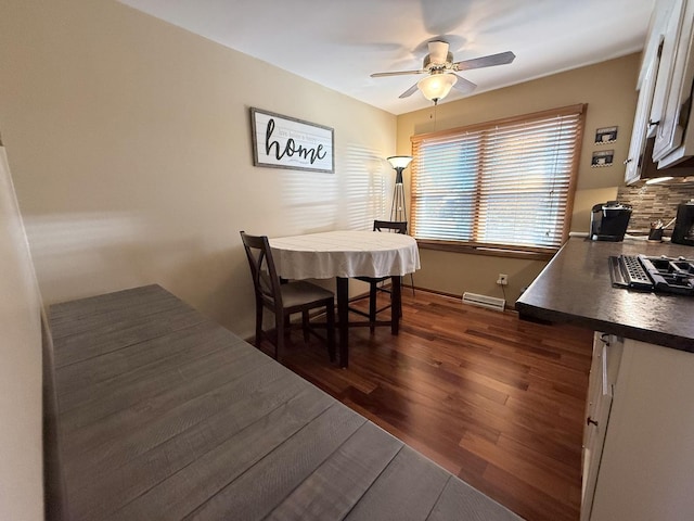 dining space featuring a ceiling fan, dark wood-style flooring, visible vents, and baseboards