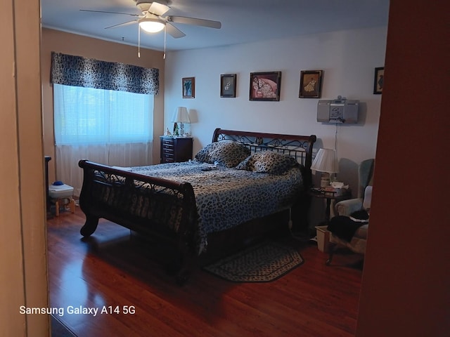 bedroom with a ceiling fan and wood finished floors