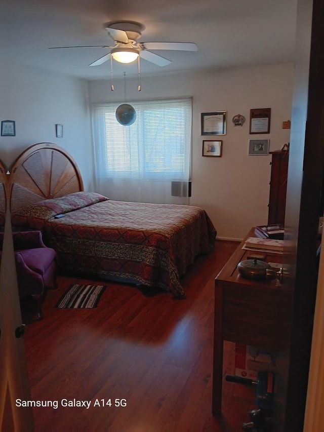 bedroom featuring ceiling fan and wood finished floors