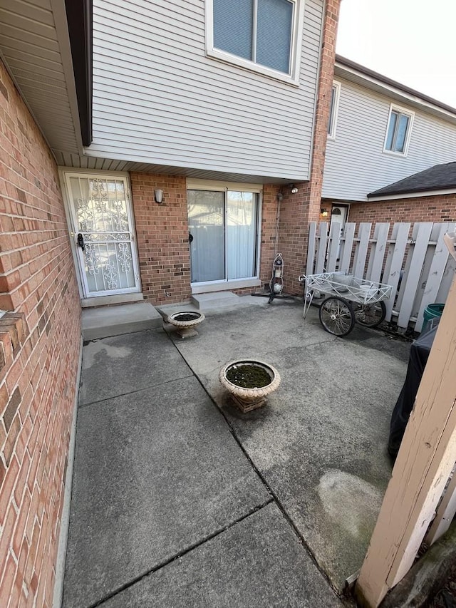 view of patio featuring fence