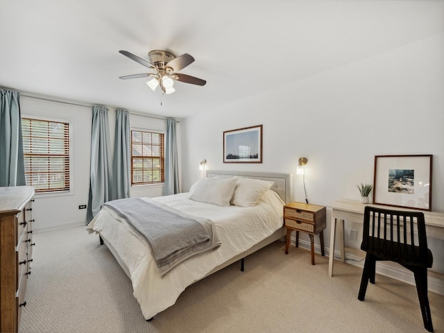 bedroom with baseboards, light carpet, and ceiling fan