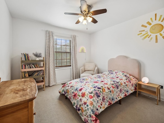 bedroom featuring ceiling fan and light carpet