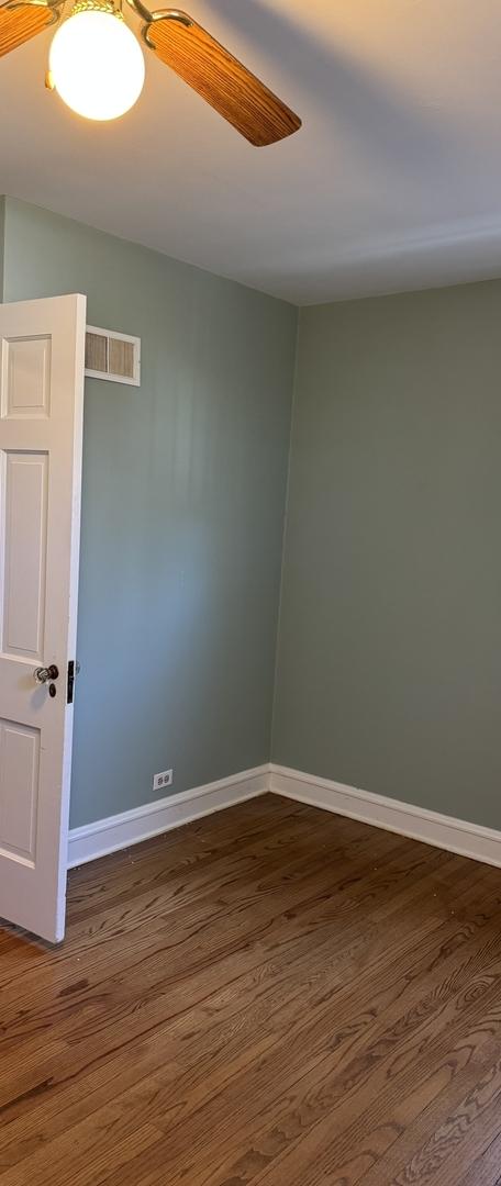 4036 Linden Ave, Western Springs, IL 60558 - empty room with visible vents, baseboards, and dark wood-style flooring