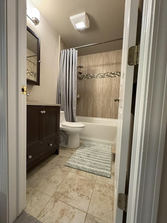 bathroom with shower / tub combo, vanity, and toilet