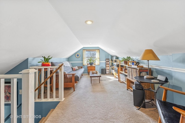 carpeted office featuring lofted ceiling