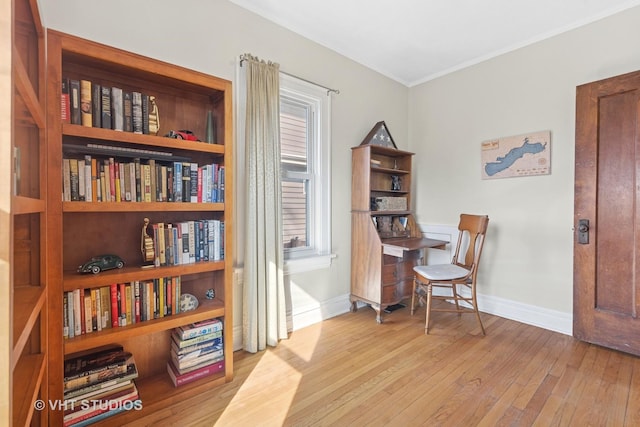 sitting room featuring baseboards and hardwood / wood-style flooring