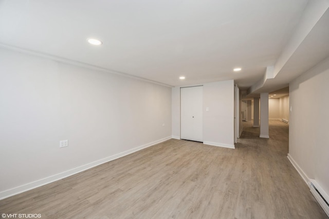 interior space with recessed lighting, baseboards, light wood-style flooring, and baseboard heating