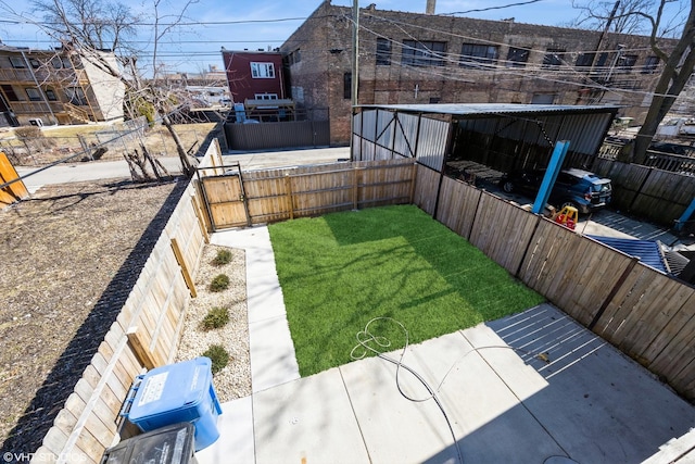 view of yard with a fenced backyard