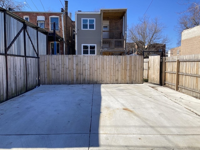 view of patio featuring fence private yard and a gate