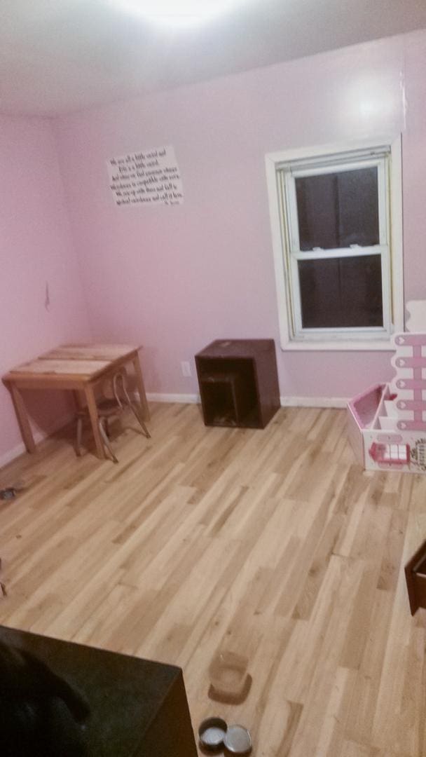 dining room with light wood finished floors and baseboards