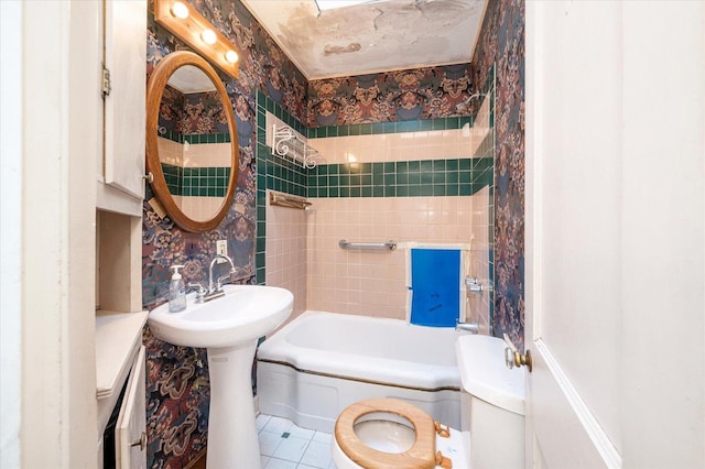 full bathroom featuring toilet, wallpapered walls, shower / washtub combination, and tile patterned floors