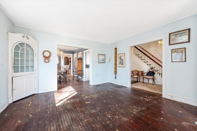 interior space featuring stairway, a chandelier, and hardwood / wood-style flooring