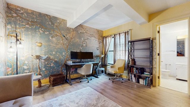 office with beam ceiling and wood finished floors