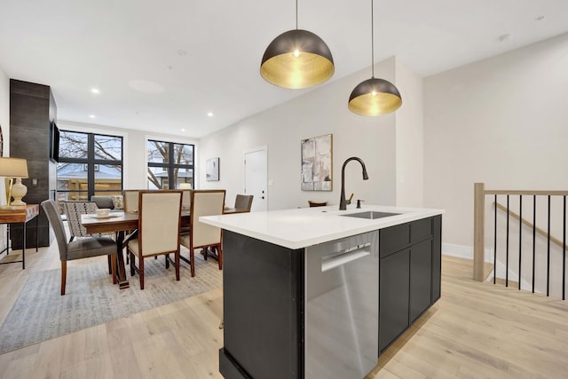 4343 N Richmond Ave Unit 1S, Chicago, IL 60618 - kitchen featuring dishwasher, light countertops, light wood-type flooring, and a sink