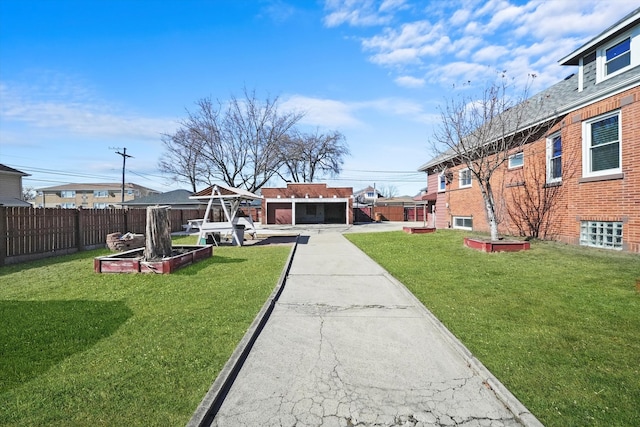 exterior space with a garden and fence