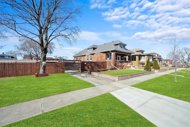 view of property exterior with a yard, fence, and a gate