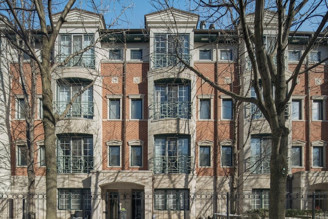 view of building exterior featuring fence