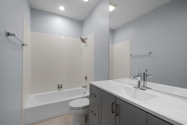 bathroom featuring shower / bath combination, vanity, toilet, and tile patterned floors