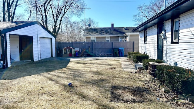 view of yard featuring central AC, an outdoor structure, and fence