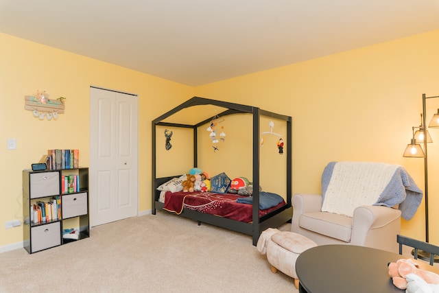 bedroom featuring carpet flooring and baseboards