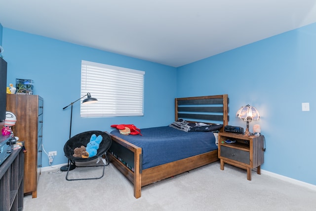 bedroom featuring carpet floors and baseboards