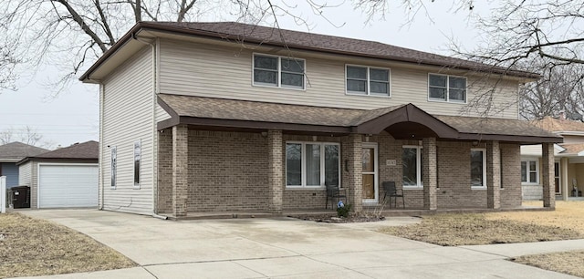 view of front of property featuring brick siding and a shingled roof