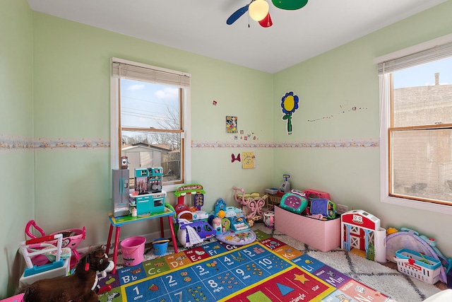 playroom featuring ceiling fan