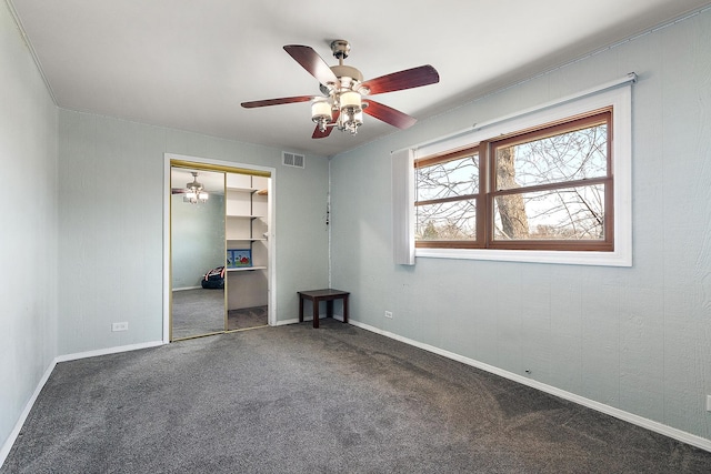 spare room with visible vents, baseboards, a ceiling fan, and carpet flooring