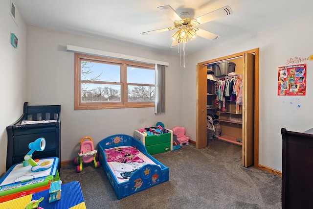 carpeted bedroom with a closet, baseboards, visible vents, and a ceiling fan