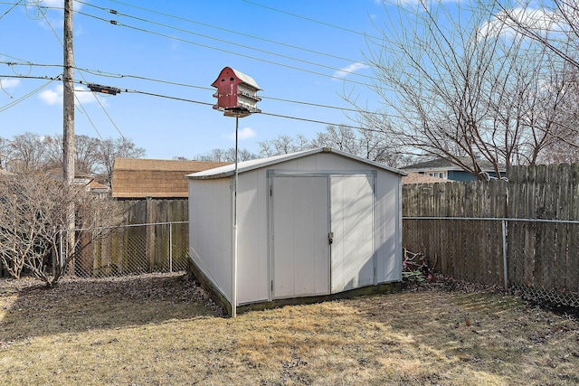 view of shed with a fenced backyard