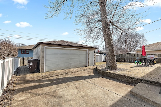 detached garage with fence