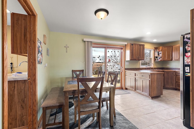 dining area featuring light tile patterned floors