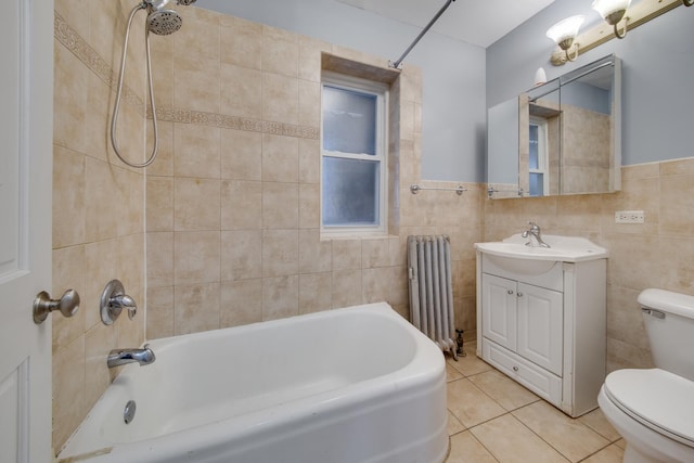 full bath featuring vanity, radiator heating unit, tile patterned flooring, tile walls, and toilet