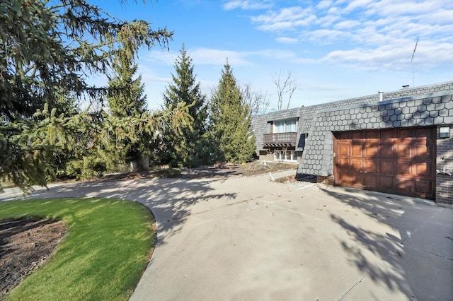 exterior space with concrete driveway