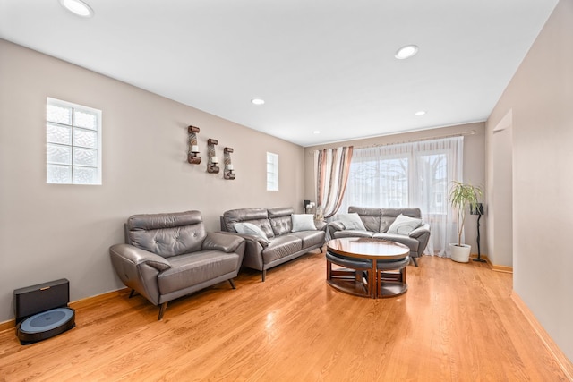 living room featuring light wood-style flooring and recessed lighting