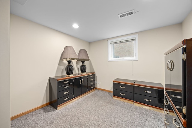 interior space featuring carpet, visible vents, baseboards, and recessed lighting