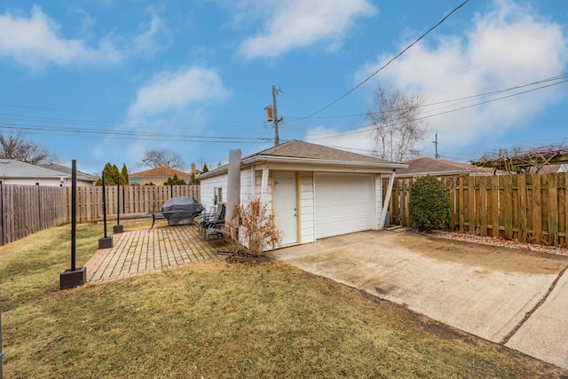 detached garage with driveway and fence