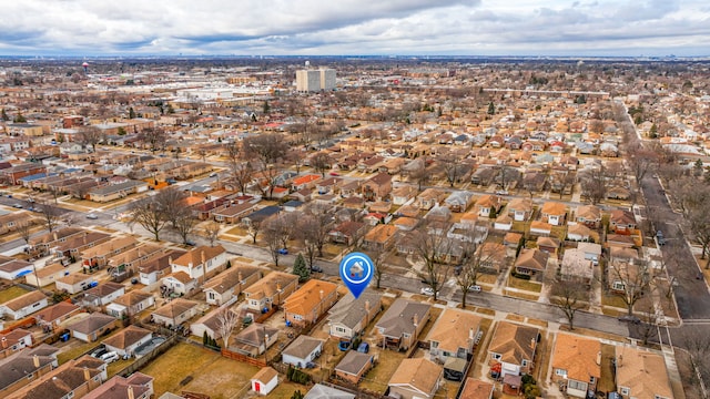 birds eye view of property with a residential view